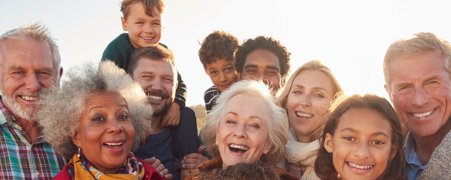 Portrait Of Multi-Generation Family Group On Winter Beach Vacation